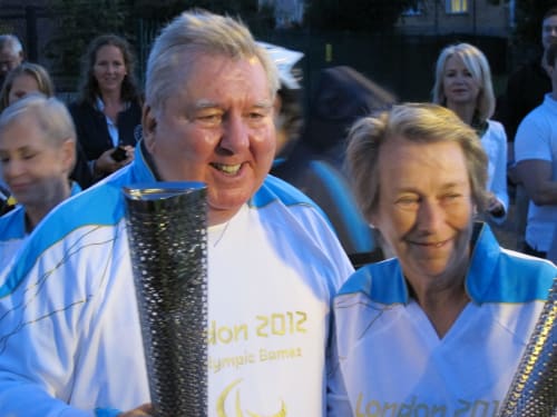 Eva Loeffler and Peter Harrison with the London 2012 Paralympics Torch