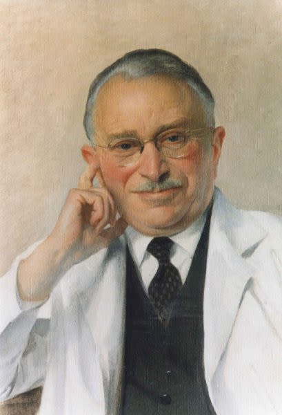 Painting of Dr Guttmann in late middle age wearing a doctors white coat